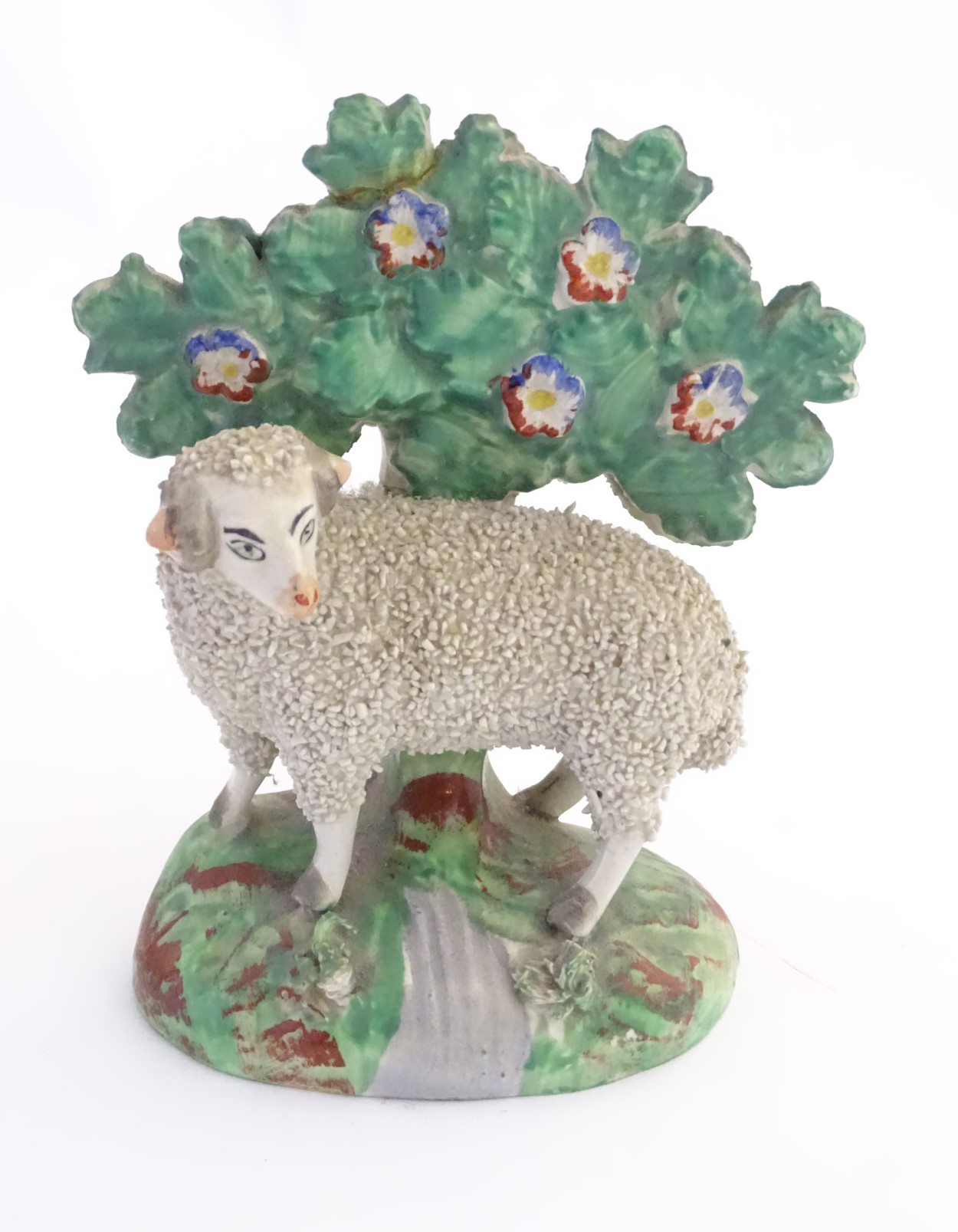 A 19thC hollow base Staffordshire figure of a sheep with floral bocage. - Image 2 of 7