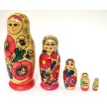 A set of Russian / Matryoshka dolls, comprising 5 graduated wooden dolls. Tallest approx.