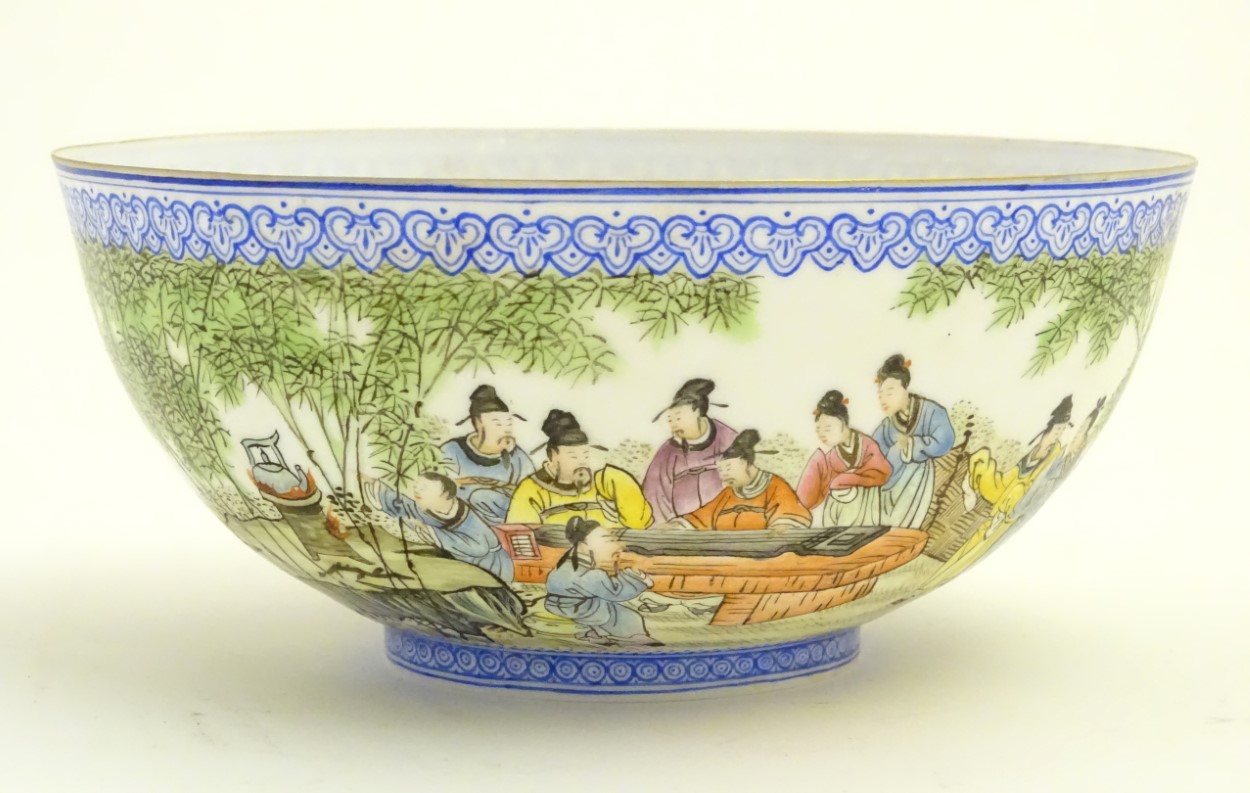 A Chinese eggshell bowl depicting Oriental figures watching a guqin performance in a landscape.