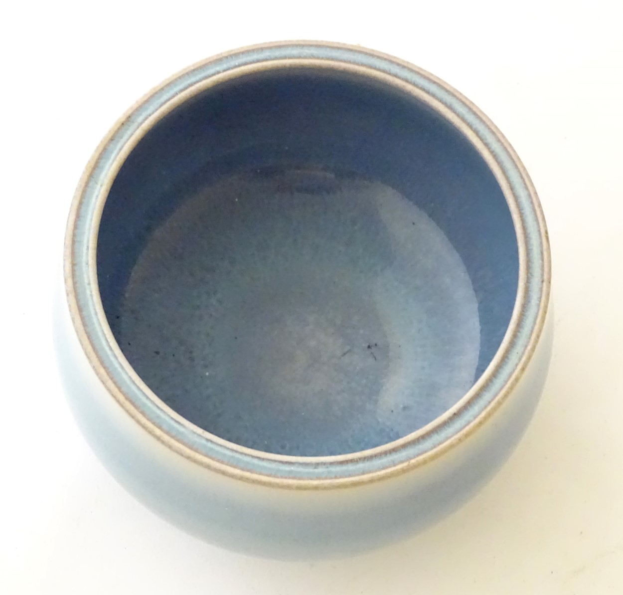 An unmarked high fired blue glazed bowl. Approx. 3" high. - Image 5 of 5