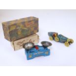 Two mid 20thC boxed tinplate toys,