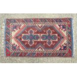 Rug / Carpet: a handmade thick woollen pile rug having purple, cream, red, white and blue colours.