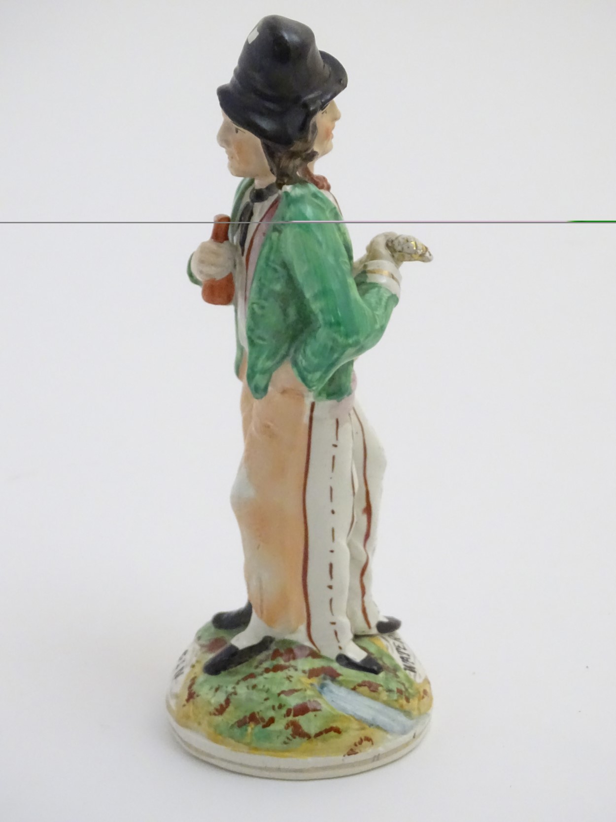 A Victorian Staffordshire pottery double-sided figure of a man standing on a circular, - Image 5 of 6