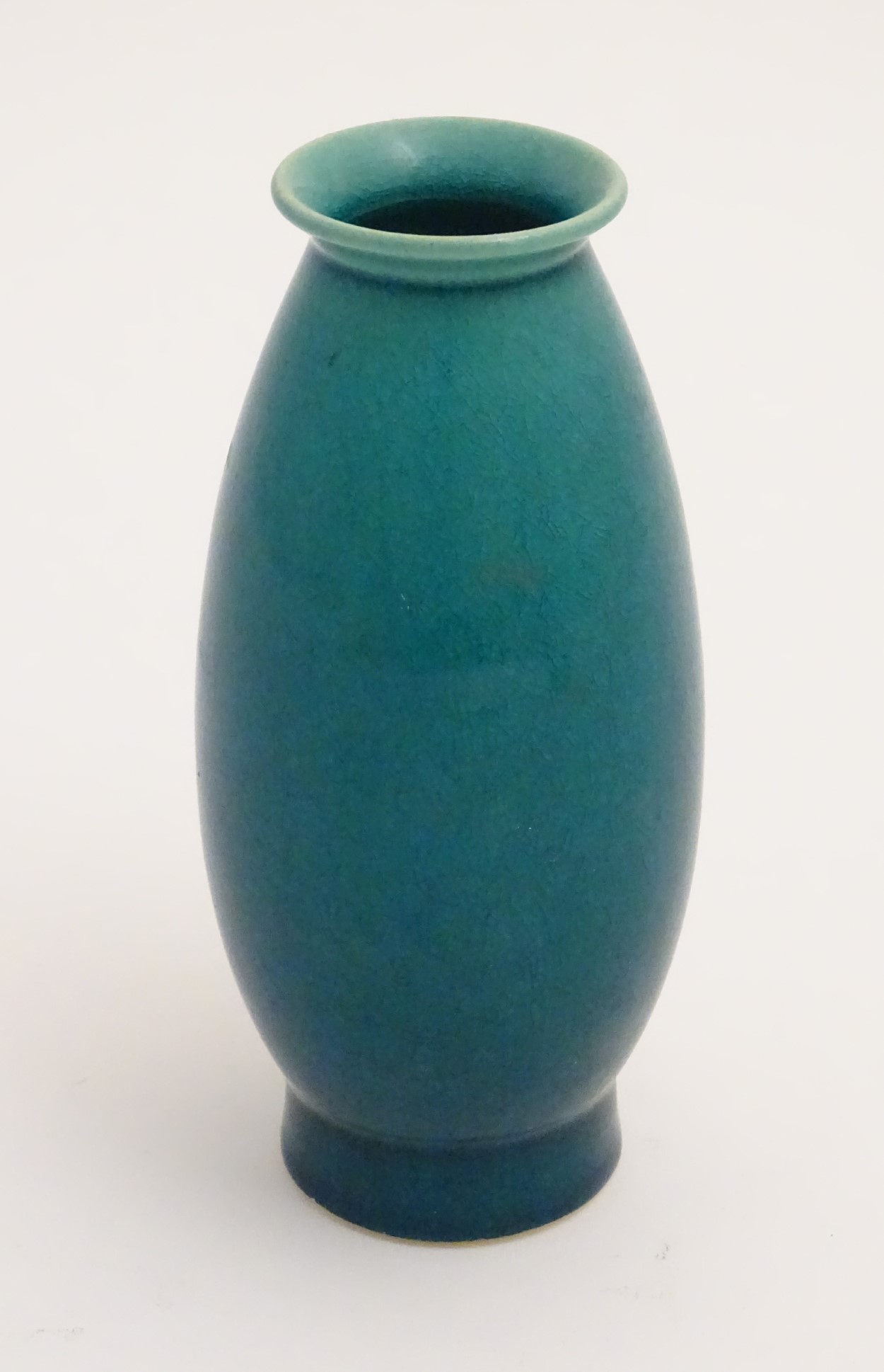 An oriental vase of ovoid form with a flared rim and base with craquelure decoration. Approx.