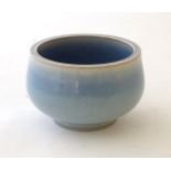 An unmarked high fired blue glazed bowl. Approx. 3" high.