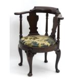 A George II mahogany open armchair,