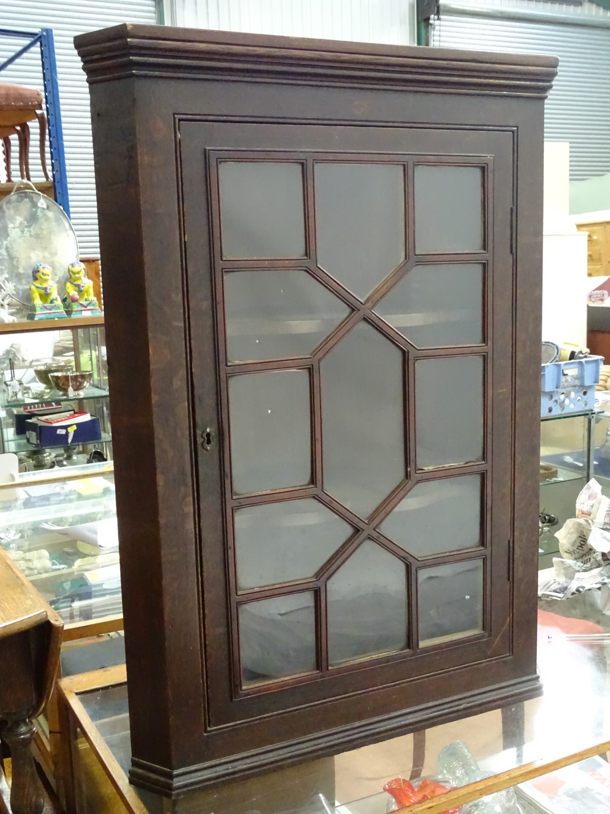 A Georgian oak glazed corner cabinet with 2 shelves CONDITION: Please Note - we do