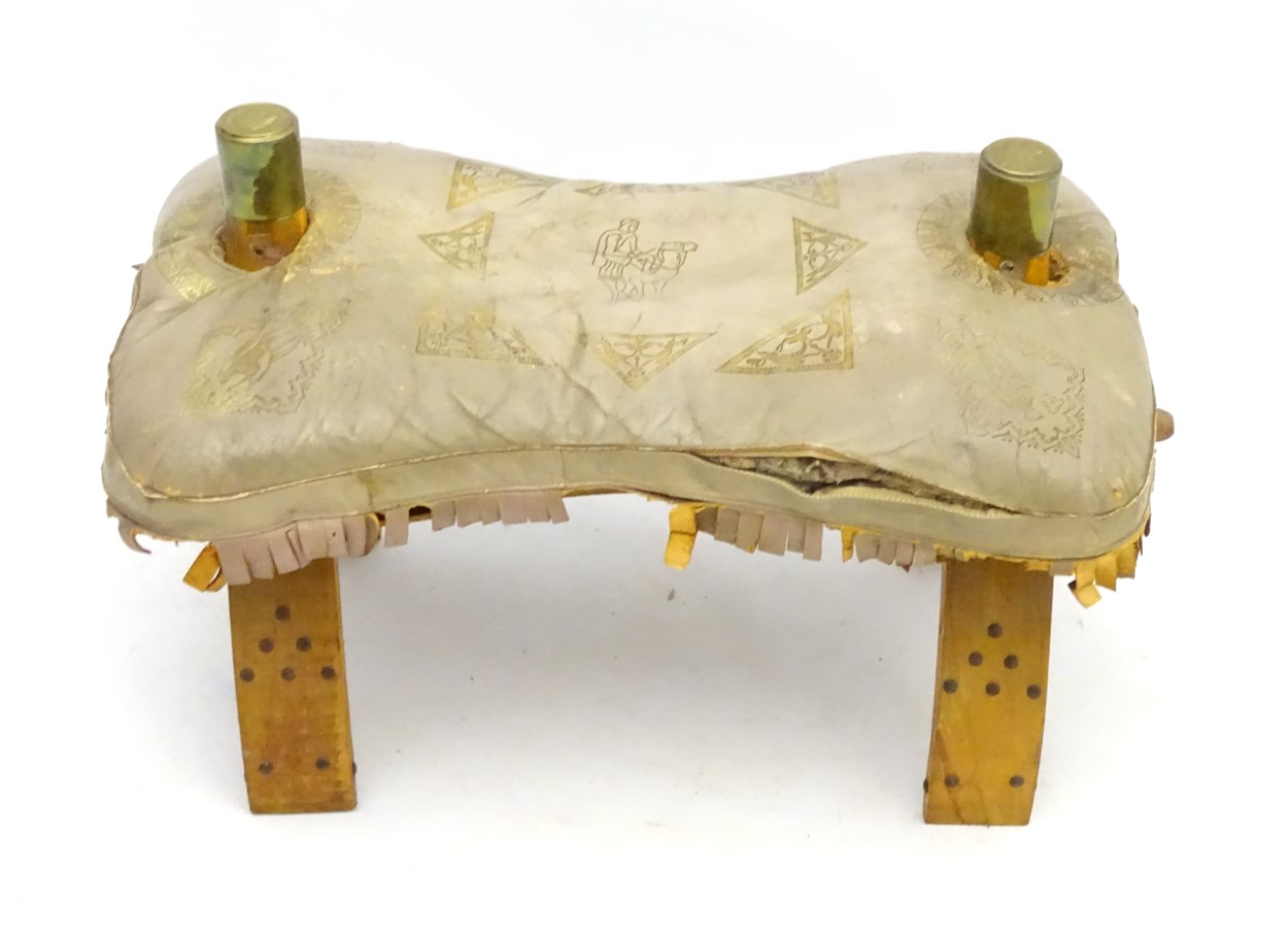 A leather camel saddle with gold tooled, detail, stud and brass work decoration. - Image 5 of 8