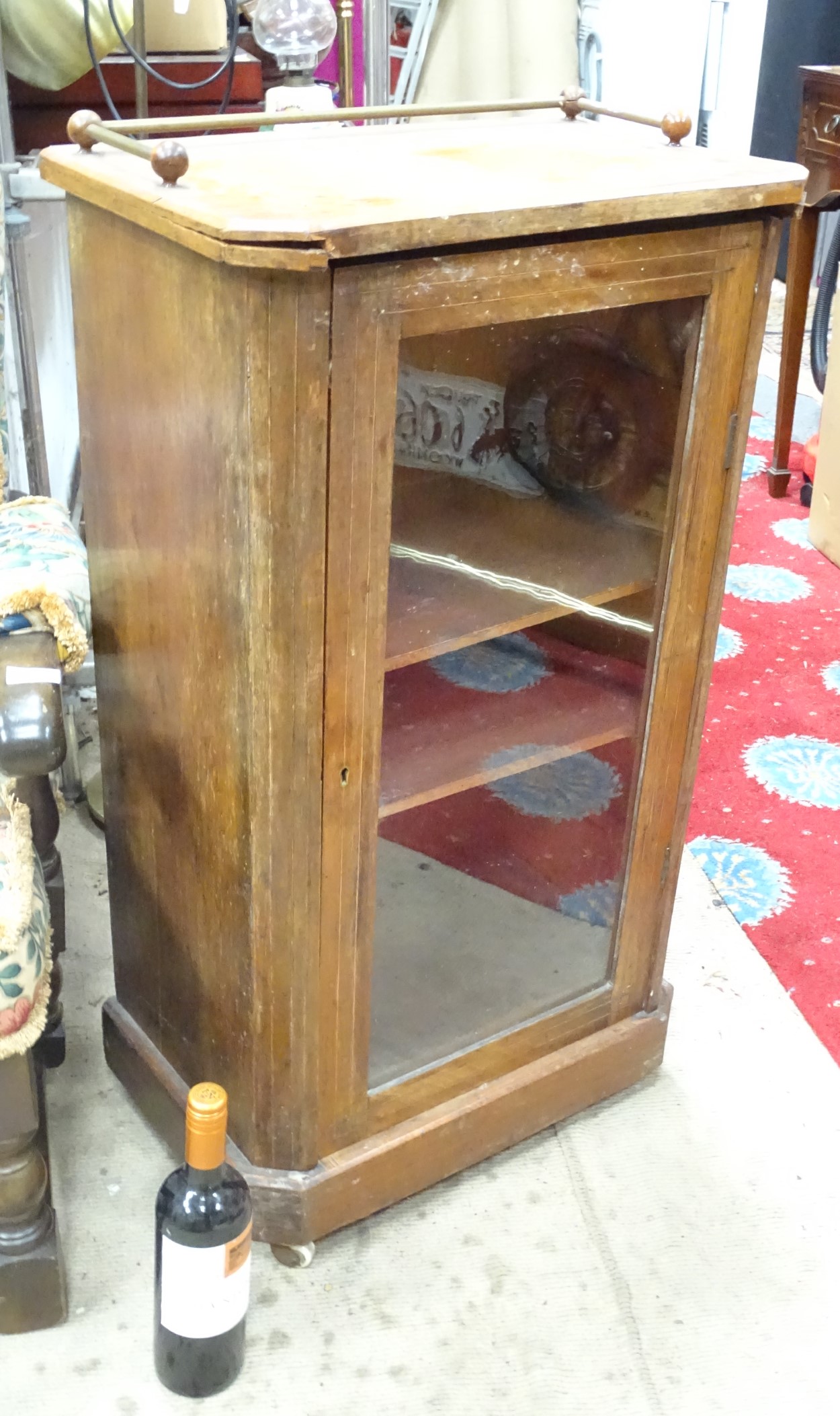 An inlaid mahogany cupboard with a glazed door CONDITION: Please Note - we do not