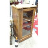 An inlaid mahogany cupboard with a glazed door CONDITION: Please Note - we do not