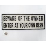 A 21stC painted cast metal sign 'Beware of the owners, enter at your own risk',