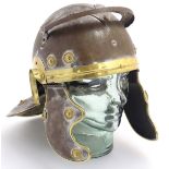 A re-enactors Roman Imperial Gallic helmet (galea), of steel and brass construction,