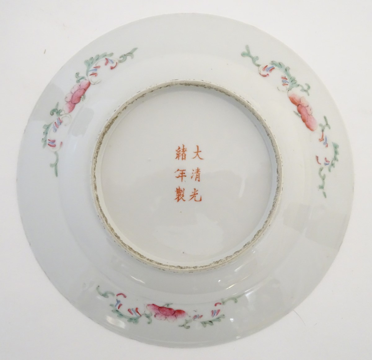 An Oriental plate decorated with stylised flowers, with a scrolling floral design to reverse. - Image 4 of 11