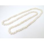 A long pearl necklace approx 44" long CONDITION: Please Note - we do not make