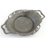 Solkets Tudric : An Art Nouveau fretted and planished / hammered two handled dish with Shamrock