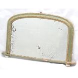 A Victorian painted over mantle mirror with a moulded frame and porcelain bun feet.