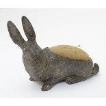 A late Victorian novelty silver plated pin cushion formed as a hare 4" long 3 3/8" high