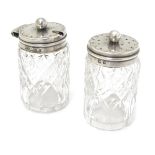 Cut glass pepper pot and mustard pot with silver tops hallmarked Birmingham 1906 maker William