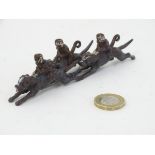 Cold Painted Bronze : a novelty figure group of three monkeys riding three hounds,