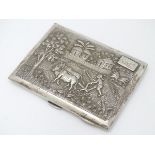 A Sterling silver cigarette case with decoration to lid depicting figure and oxen ploughing the