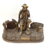 A 19thC Continental (Black Forest ?) carved wood sculpture of a seated French sportsman holding a