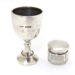 A silver egg cup hallmarked Birmingham 1935 maker S Blanckensee & Son Ltd.