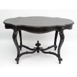 A late 19thC ebonised centre table,