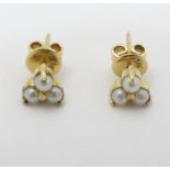 A pair of gold stud earring set with pearls CONDITION: Please Note - we do not