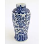A Chinese blue and white vase decorated with emblems of good fortune,