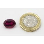Unmounted stone: A red oval cut Ruby. approx 8.