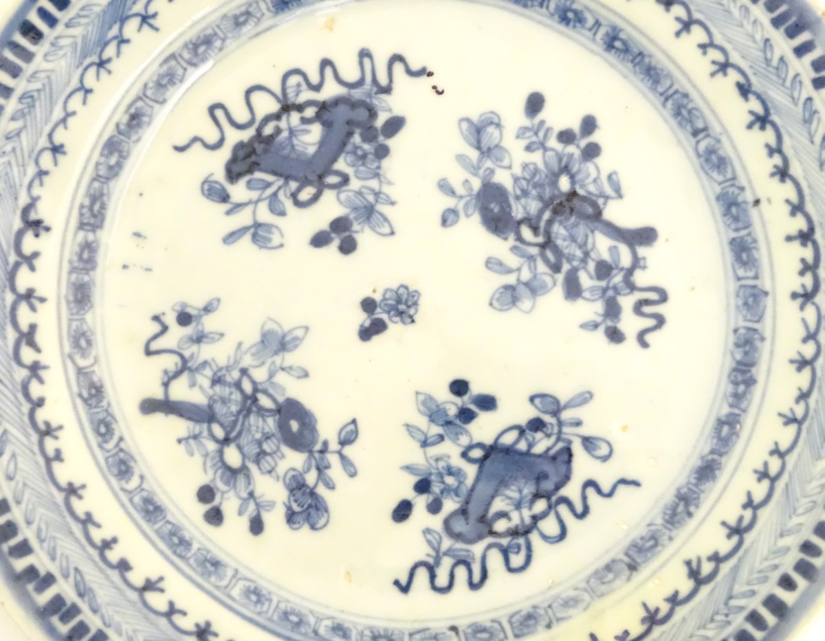 An 18thC Chinese blue and white plate decorated with Daoist emblems, and banded patterned borders. - Image 7 of 8