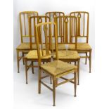 A set of six oak Arts and Crafts dining chairs with pierced back splat,