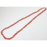 A vintage coral necklace formed from coral branch beads.