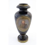 A black memorial glass vase decorated with a portrait of a high ranking German officer / military