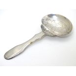 A Portuguese .833 silver tea caddy spoon with engraved decoration and marked Topazio.