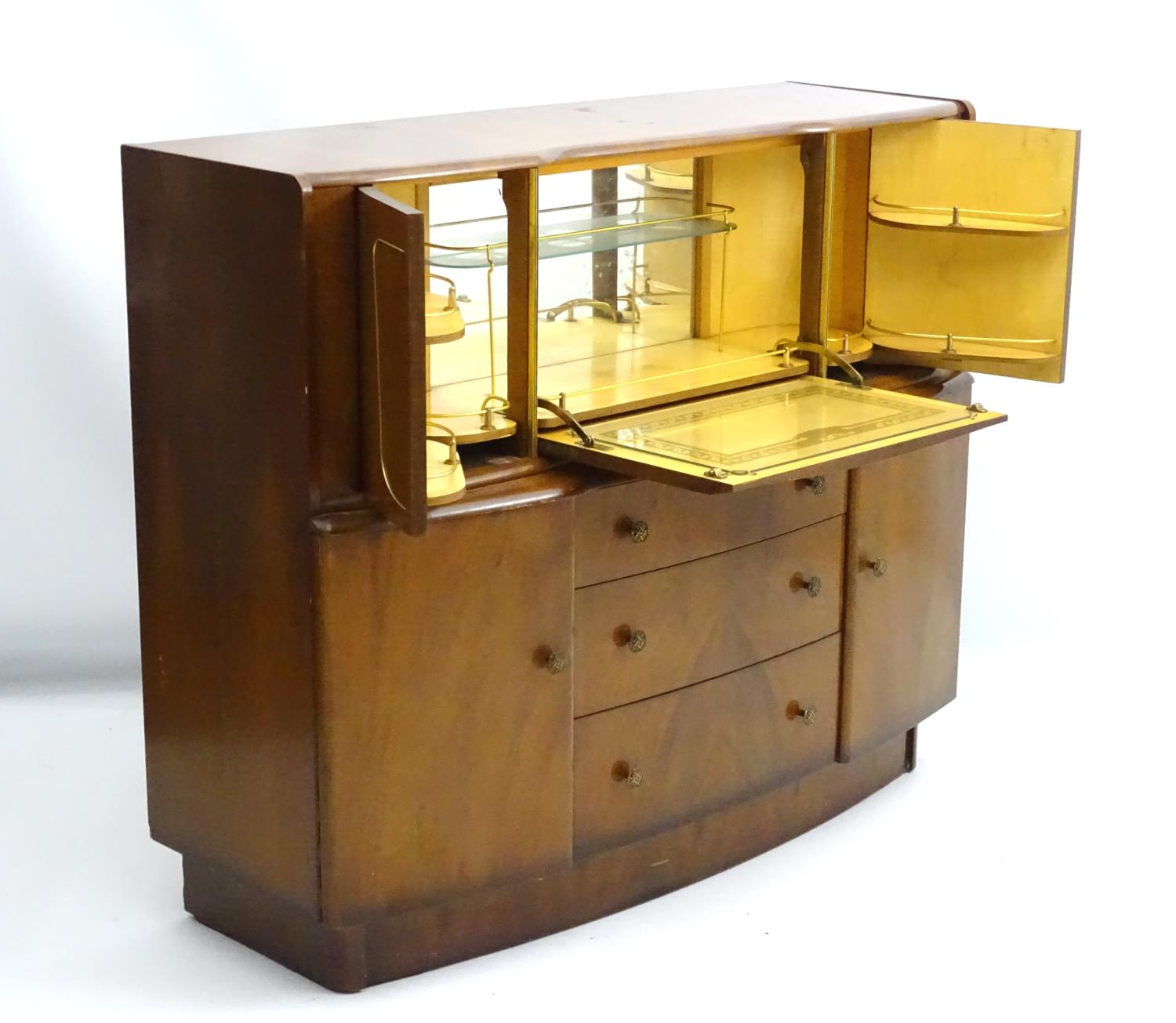 A 1930’s walnut cocktail cabinet, the top opening to reveal fitted shelves and a mirrored back. - Image 2 of 12