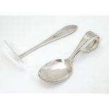 A silver child's spoon and pusher hallmarked 1927 maker Arthur Price & Co.