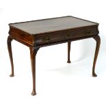 A 19thC mahogany silver table with a raised outer edge,