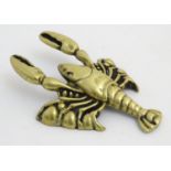 A contemporary cast brass boot pull in the form of a lobster. 10 1/2” long.