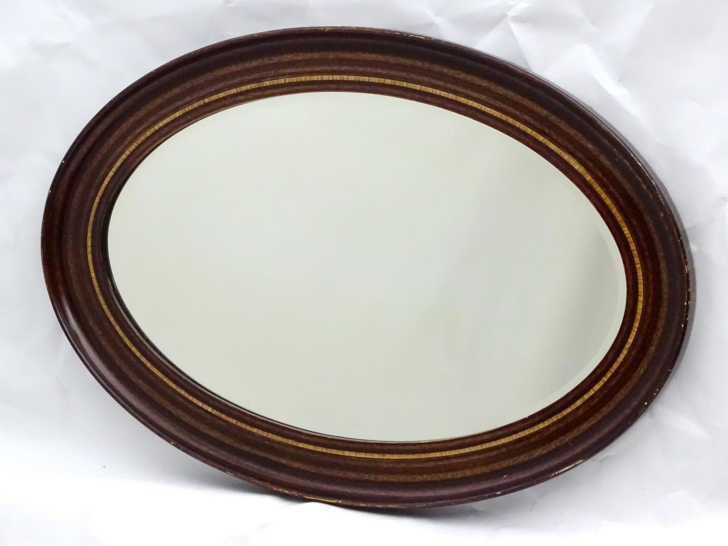 A mid 20thC oval bevelled mirror with crossbanded detailing to the frame. - Image 10 of 10