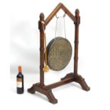 A 19thC oak Gothic Revival dinner gong,