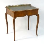 A mid 19thC mahogany table, with a gilt brass gallery,