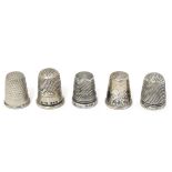 5 assorted thimbles including 2 hallmarked silver examples and a .