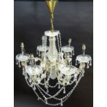 Chandelier: a glass 6 branch pendant electrolier with brass fitments, 22” wide x 16” high.