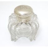 A Victorian glass inkwell with silver top hallmarked London 1897 maker Hukin & Heath.