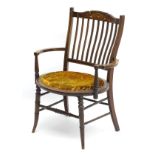 An early 20thC mahogany Sheraton revival small proportion open armchair,