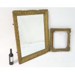 Two early 20thC gilt and gesso frames, one containing a mirror. The largest 37" wide x 32" high.