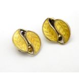 Scandinavian Jewellery: A pair of Norwegian silver gilt earrings of leaf form with yellow enamel