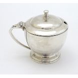 An Art Deco silver mustard pot Hallmarked London 1939 maker Harrods Ltd ( Richard Woodman