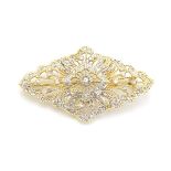 A 18ct gold brooch set with a profusion of diamonds.